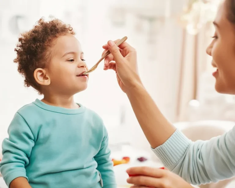 A variety of healthy snacks for kids including fruits, dips, and yogurt popsicles.